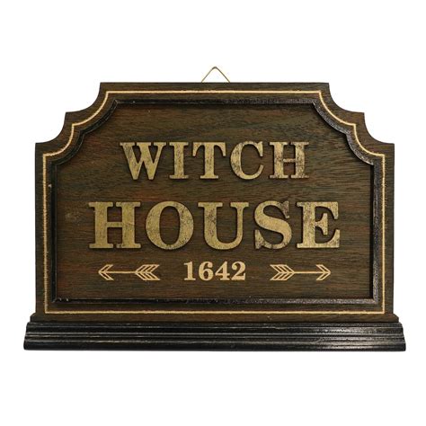 Wall sign with a witch design by ashland